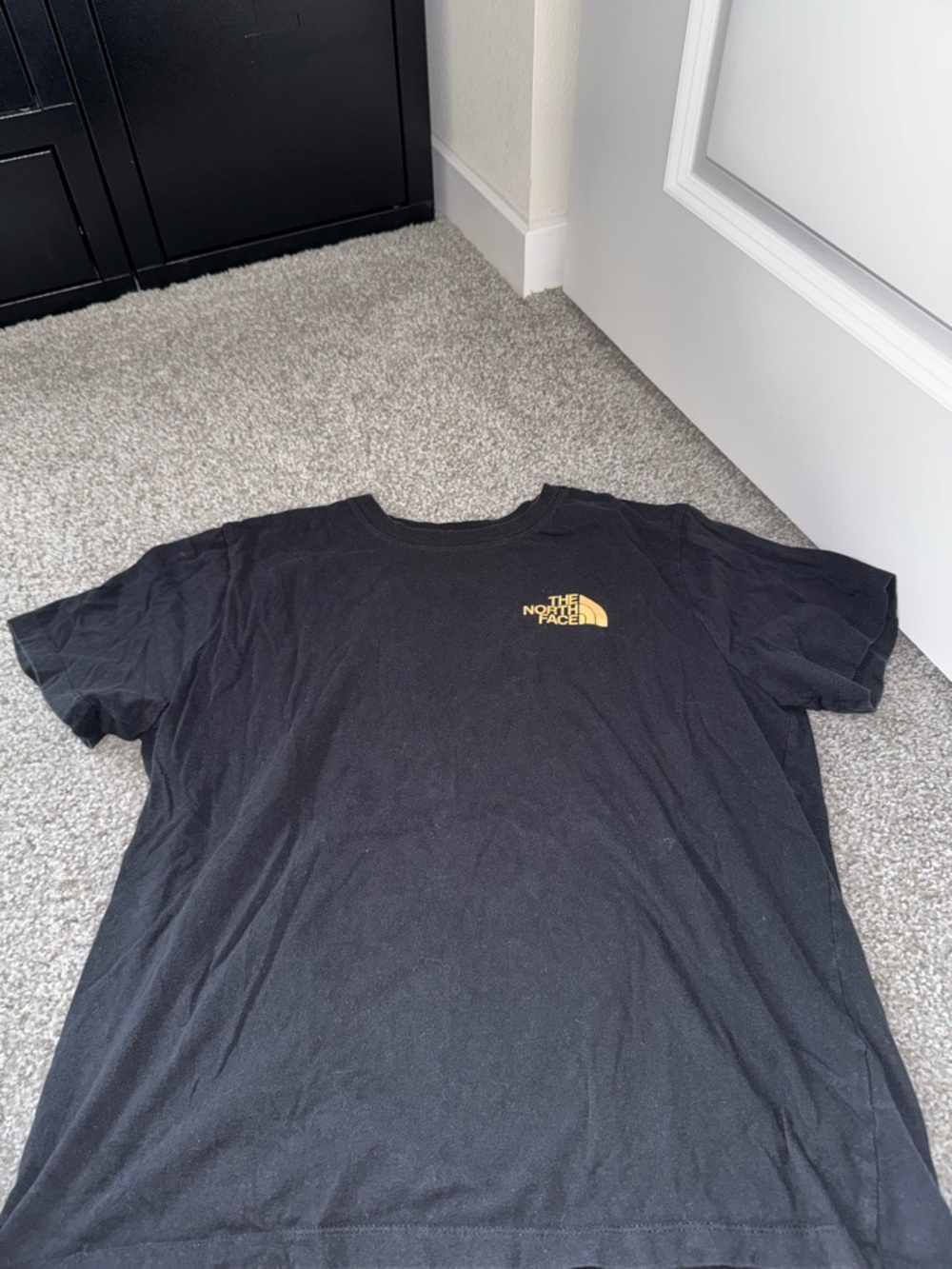 The North Face Black Tee with Yellow Chest Logo